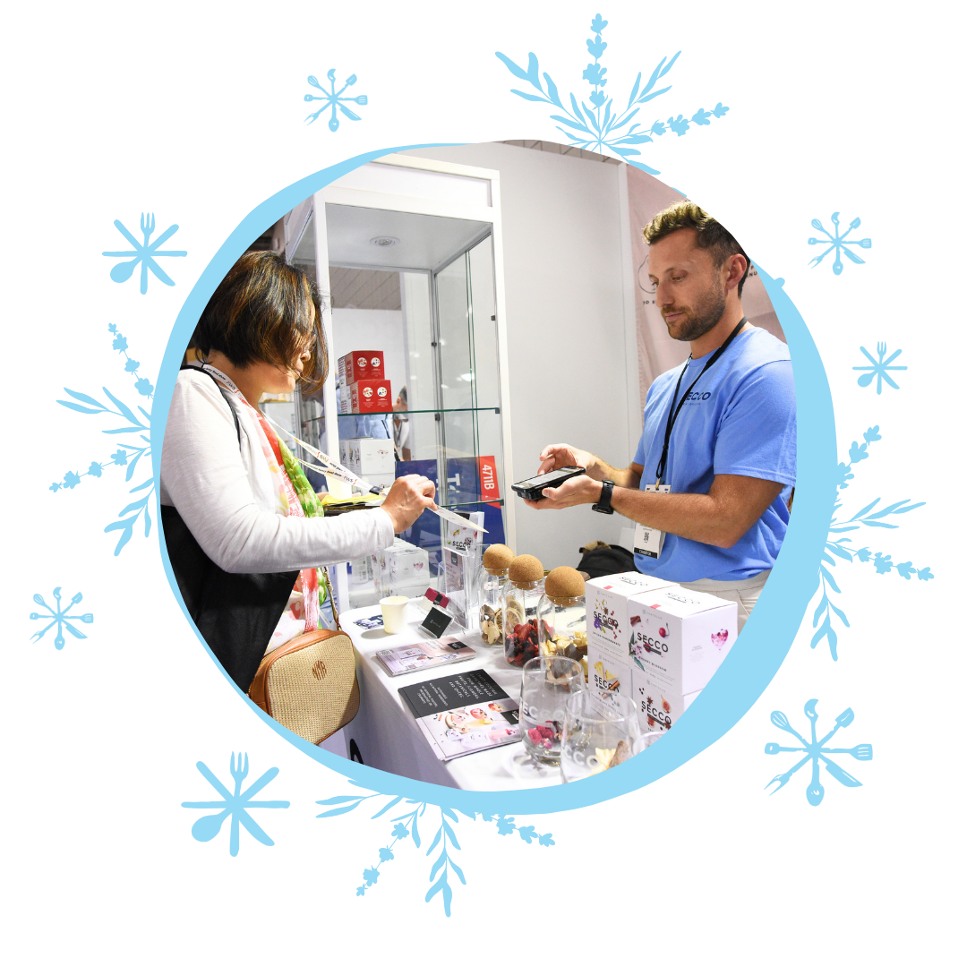 Attendee and exhibitor at a booth