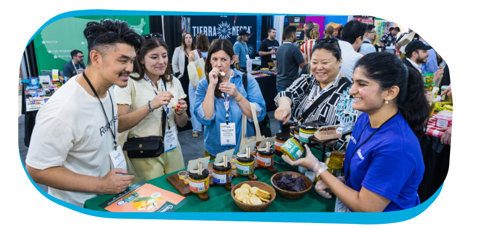 Exhibitors and attendees enjoying samples